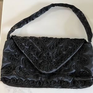 NWOT black embroidered handbag. Perfect for a fun nite out!